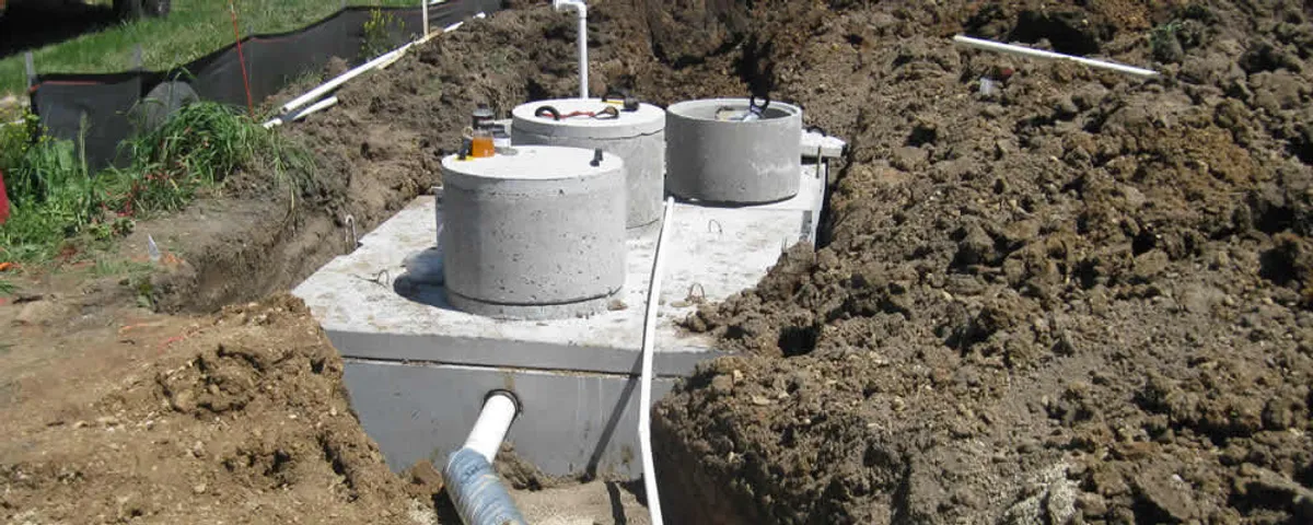 Septic system repair and installation site with tank access ports in Warwick, RI