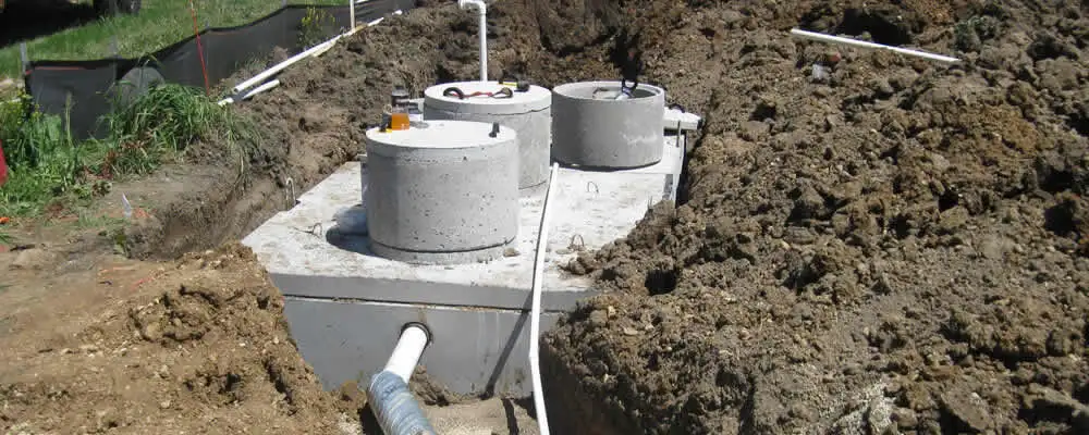 Septic system repair and installation site with tank access ports in Warwick, RI